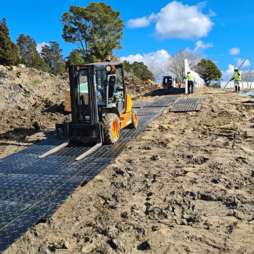 TerraTrack Ground Protection Mat creating temporary vehicle access on muddy ground